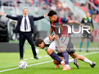 Santiago Castro of Bologna FC and Botond Balogh of Parma Calcio 1903 compete for the ball during the Serie A Enilive match between Bologna F...