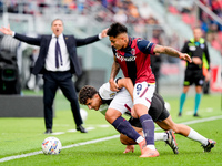 Santiago Castro of Bologna FC and Botond Balogh of Parma Calcio 1903 compete for the ball during the Serie A Enilive match between Bologna F...