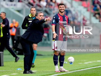 Riccardo Orsolini of Bologna FC argues with Fabio Pecchia head coach of Parma Calcio 1903 head coach of Bologna FC during the Serie A Eniliv...