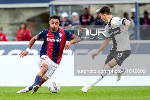 Dan Ndoye of Bologna FC and Enrico Delprato of Parma Calcio 1903 compete for the ball during the Serie A Enilive match between Bologna FC an...