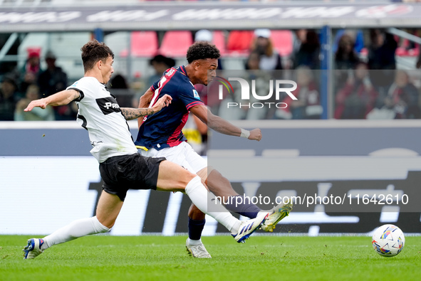 Dan Ndoye of Bologna FC and Enrico Delprato of Parma Calcio 1903 compete for the ball during the Serie A Enilive match between Bologna FC an...