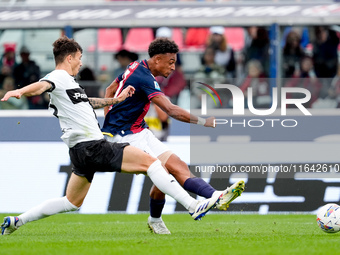 Dan Ndoye of Bologna FC and Enrico Delprato of Parma Calcio 1903 compete for the ball during the Serie A Enilive match between Bologna FC an...