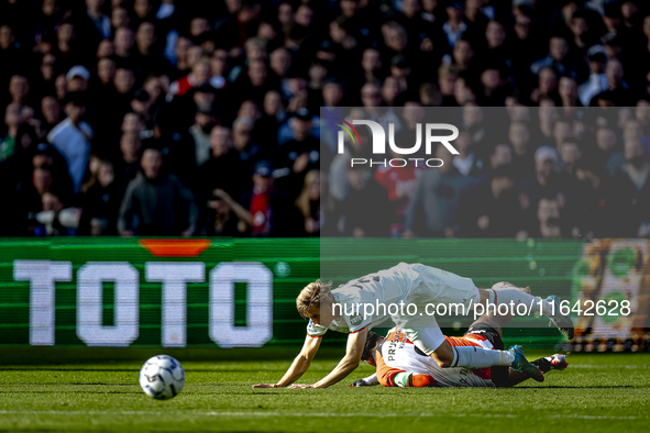 Feyenoord Rotterdam midfielder Quinten Timber and FC Twente defender Max Bruns play during the match between Feyenoord and Twente at the Fey...