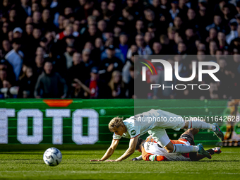 Feyenoord Rotterdam midfielder Quinten Timber and FC Twente defender Max Bruns play during the match between Feyenoord and Twente at the Fey...