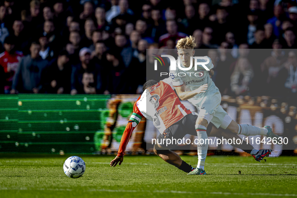 Feyenoord Rotterdam midfielder Quinten Timber and FC Twente defender Max Bruns play during the match between Feyenoord and Twente at the Fey...