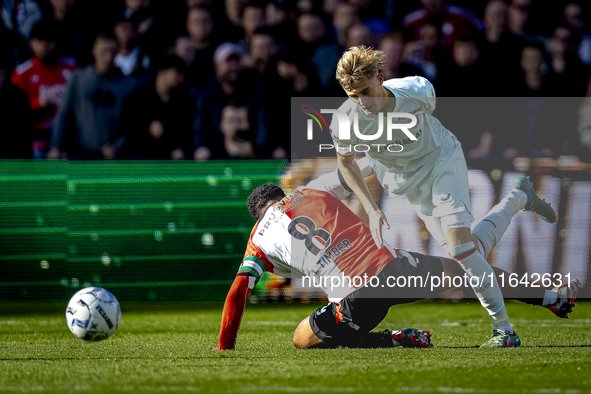 Feyenoord Rotterdam midfielder Quinten Timber and FC Twente defender Max Bruns play during the match between Feyenoord and Twente at the Fey...