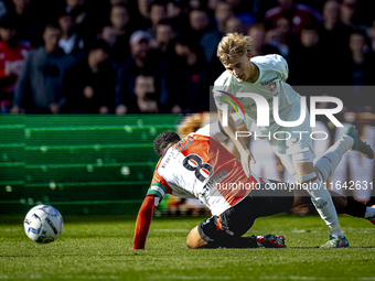 Feyenoord Rotterdam midfielder Quinten Timber and FC Twente defender Max Bruns play during the match between Feyenoord and Twente at the Fey...