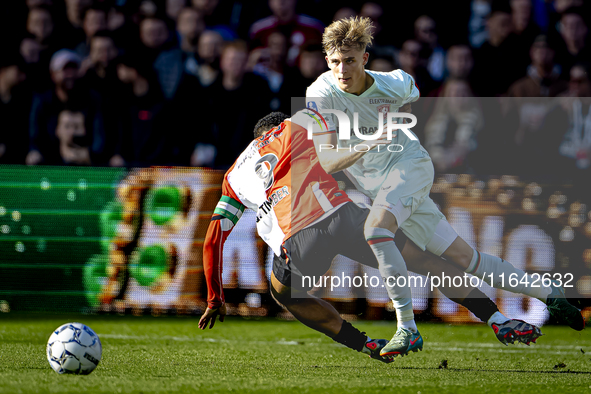 Feyenoord Rotterdam midfielder Quinten Timber and FC Twente defender Max Bruns play during the match between Feyenoord and Twente at the Fey...