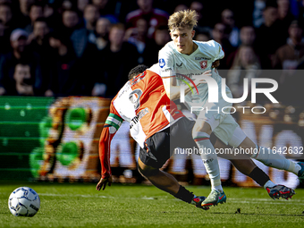 Feyenoord Rotterdam midfielder Quinten Timber and FC Twente defender Max Bruns play during the match between Feyenoord and Twente at the Fey...