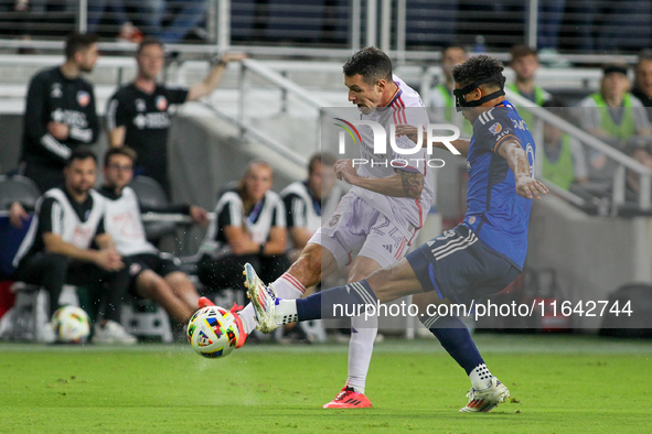 Orlando defender Kyle Smith takes a shot on goal during the Major League Soccer match between FC Cincinnati and Orlando City SC at TQL Stadi...