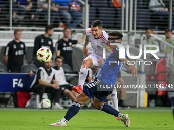 Orlando defender Kyle Smith takes a shot on goal during the Major League Soccer match between FC Cincinnati and Orlando City SC at TQL Stadi...