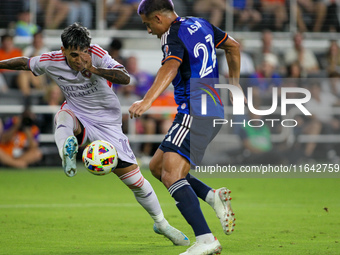 Orlando midfielder Facundo Torres and Cincinnati midfielder Yamil Asad compete for the ball during the Major League Soccer match between FC...