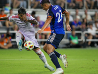 Orlando midfielder Facundo Torres and Cincinnati midfielder Yamil Asad compete for the ball during the Major League Soccer match between FC...