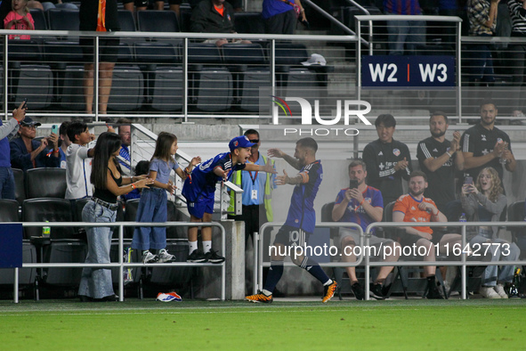 Cincinnati midfielder Luciano Acosta celebrates with his family after scoring a goal during the Major League Soccer match between FC Cincinn...