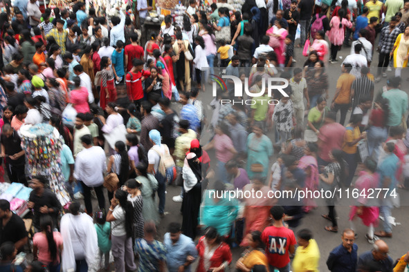 People shop at a crowded market ahead of the Durga Puja festival in Kolkata, India, on October 6, 2024. The annual Durga Puja festival, whic...