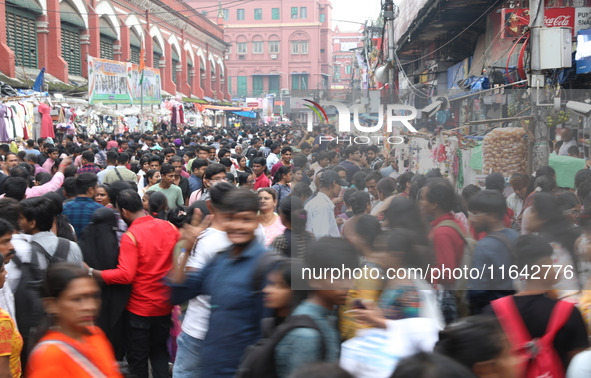 People shop at a crowded market ahead of the Durga Puja festival in Kolkata, India, on October 6, 2024. The annual Durga Puja festival, whic...