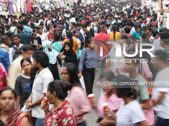 People shop at a crowded market ahead of the Durga Puja festival in Kolkata, India, on October 6, 2024. The annual Durga Puja festival, whic...