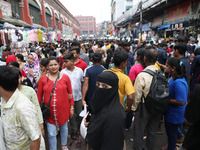 People shop at a crowded market ahead of the Durga Puja festival in Kolkata, India, on October 6, 2024. The annual Durga Puja festival, whic...