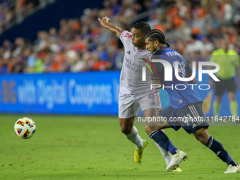 Cincinnati defender DeAndre Yedlin and Orlando attacker Luis Muriel compete for the ball during the Major League Soccer match between FC Cin...