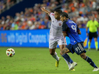 Cincinnati defender DeAndre Yedlin and Orlando attacker Luis Muriel compete for the ball during the Major League Soccer match between FC Cin...