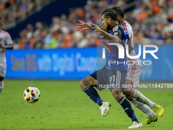 Cincinnati defender DeAndre Yedlin and Orlando attacker Luis Muriel compete for the ball during the Major League Soccer match between FC Cin...