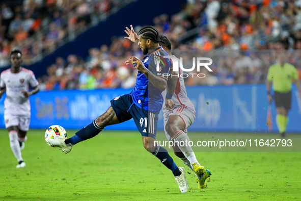 Cincinnati defender DeAndre Yedlin and Orlando attacker Luis Muriel compete for the ball during the Major League Soccer match between FC Cin...