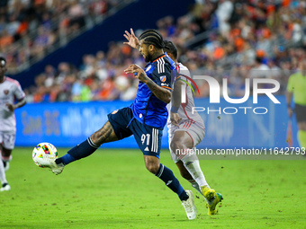 Cincinnati defender DeAndre Yedlin and Orlando attacker Luis Muriel compete for the ball during the Major League Soccer match between FC Cin...