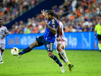 Cincinnati defender DeAndre Yedlin and Orlando attacker Luis Muriel compete for the ball during the Major League Soccer match between FC Cin...