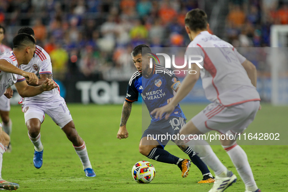 Cincinnati midfielder Luciano Acosta moves the ball upfield during the Major League Soccer match between FC Cincinnati and Orlando City SC a...