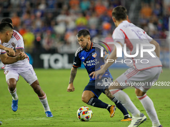 Cincinnati midfielder Luciano Acosta moves the ball upfield during the Major League Soccer match between FC Cincinnati and Orlando City SC a...