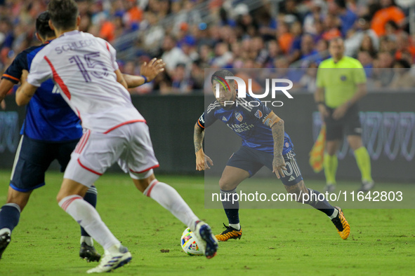 Cincinnati midfielder Luciano Acosta moves the ball upfield during the Major League Soccer match between FC Cincinnati and Orlando City SC a...