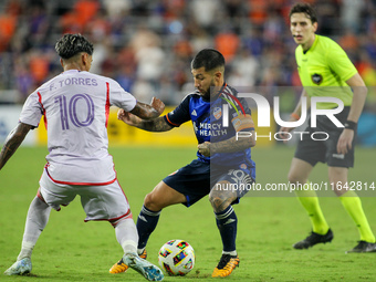 Cincinnati midfielder Luciano Acosta and Orlando midfielder Facundo Torres compete for the ball during the Major League Soccer match between...