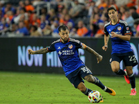 Cincinnati midfielder Luciano Acosta moves the ball upfield during the Major League Soccer match between FC Cincinnati and Orlando City SC a...