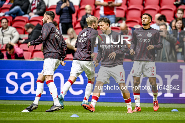 AFC Ajax Amsterdam forward Mika Godts and AFC Ajax Amsterdam defender Devyne Rensch participate in the match between Ajax and Groningen at t...