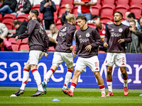 AFC Ajax Amsterdam forward Mika Godts and AFC Ajax Amsterdam defender Devyne Rensch participate in the match between Ajax and Groningen at t...