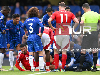 Morgan Gibbs-White of Nottingham Forest receives medical attention during the Premier League match between Chelsea and Nottingham Forest at...