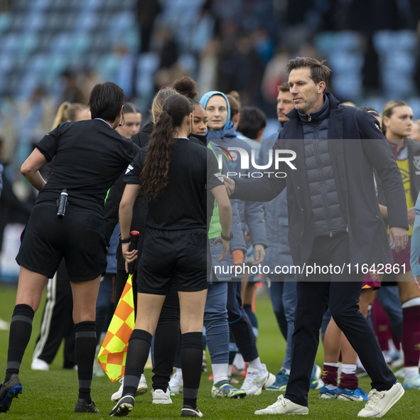 Manchester City W.F.C. manager Gareth Taylor shakes hands with the officials during the Barclays FA Women's Super League match between Manch...