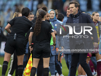 Manchester City W.F.C. manager Gareth Taylor shakes hands with the officials during the Barclays FA Women's Super League match between Manch...