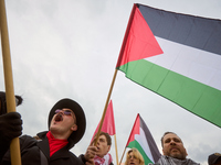 People chant during a Palestine support rally in Warsaw, Poland on 05 October, 2024. About a hundred people marched from the Royal Castle Sq...