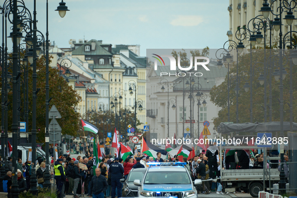 People take part in a rally in support of Palestine and Gaza in Warsaw, Poland on 05 October, 2024. About a hundred people marched from the...