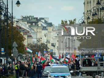 People take part in a rally in support of Palestine and Gaza in Warsaw, Poland on 05 October, 2024. About a hundred people marched from the...