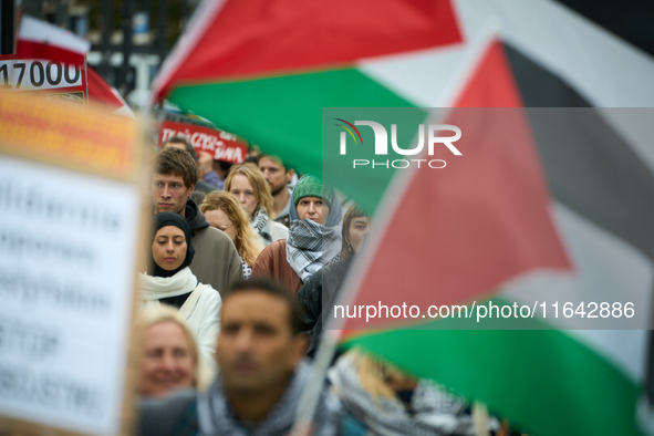 People take part in a rally in support of Palestine and Gaza in Warsaw, Poland on 05 October, 2024. About a hundred people marched from the...