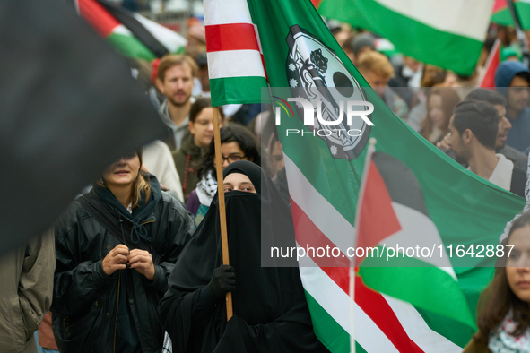 A woman wearing a burqa is seen during a rally in support of Palestine in Warsaw, Poland on 05 October, 2024. About a hundred people marched...