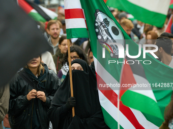 A woman wearing a burqa is seen during a rally in support of Palestine in Warsaw, Poland on 05 October, 2024. About a hundred people marched...