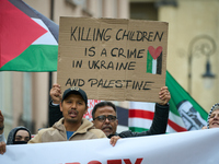 A man holds a sign during a Palestine support rally in Warsaw, Poland on 05 October, 2024. About a hundred people marched from the Royal Cas...