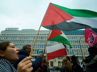 A woman holds a Palestinian flag during a rally in Warsaw, Poland on 05 October, 2024. About a hundred people marched from the Royal Castle...