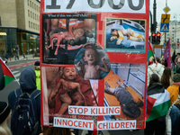 A woman holds a sign with images of dead children during a Palestine support rally in Warsaw, Poland on 05 October, 2024. About a hundred pe...