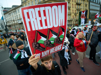 A woman holds up a sign during a Palestine support rally in Warsaw, Poland on 05 October, 2024. About a hundred people marched from the Roya...