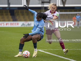 Khadija Shaw #21 of Manchester City W.F.C. is challenged by Shannon Cooke #21 of West Ham United F.C. during the Barclays FA Women's Super L...