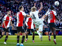 Feyenoord Rotterdam defender Thomas Beelen, FC Twente midfielder Sem Steijn, and Feyenoord Rotterdam defender Jordan Lotomba participate dur...